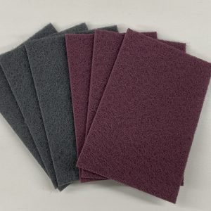 Woven abrasive pads